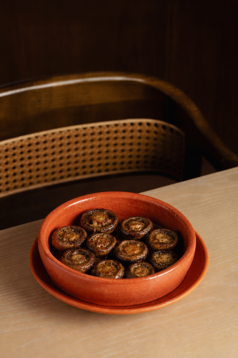 Mushrooms in a clay pan